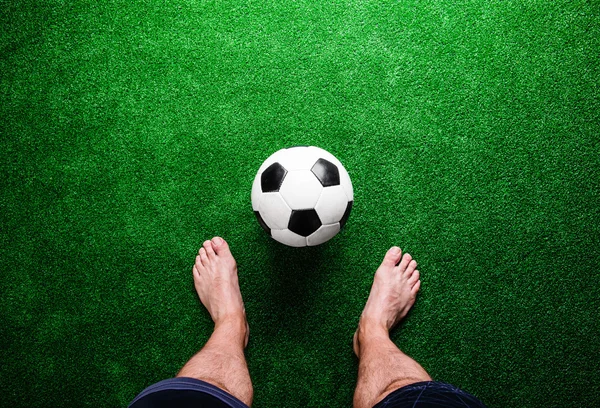 Barefoot football player with ball — Stock Photo, Image