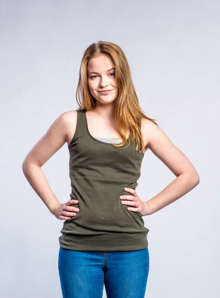 Girl in jeans and singlet, young woman, studio shot — Stock Photo, Image