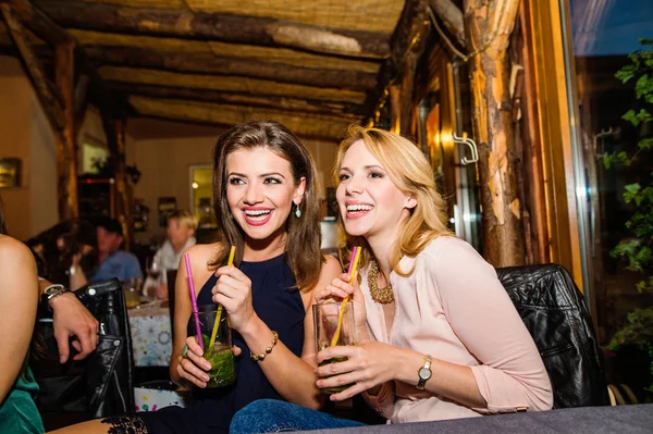 Young beautiful women with cocktails in bar or club — Stock Photo, Image