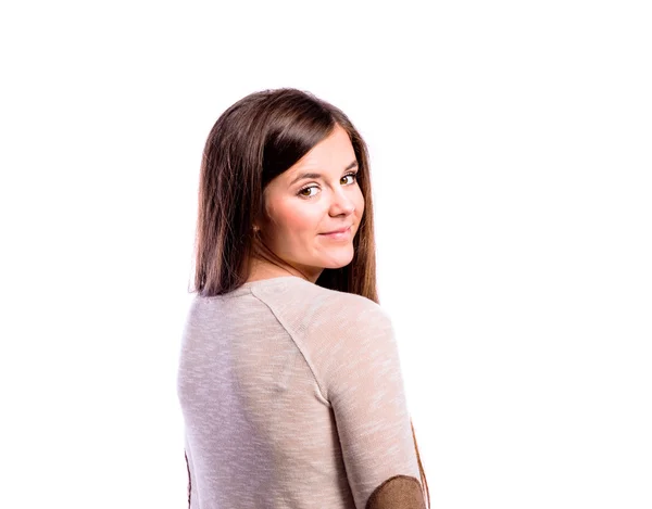 Girl in brown sweater, young woman, studio shot — Stock Photo, Image