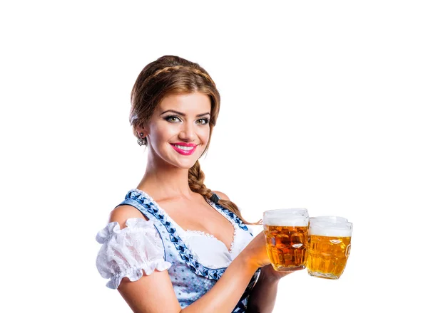 Woman in bavarian dress holding beer — Stock Photo, Image