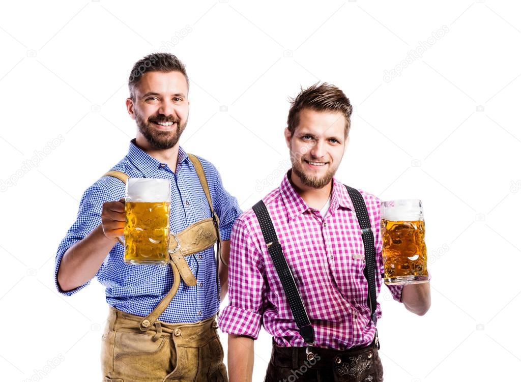 Men in bavarian clothes with beer