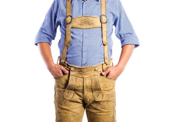 Unrecognizable man in traditional bavarian clothes, hands in poc — Stock Photo, Image