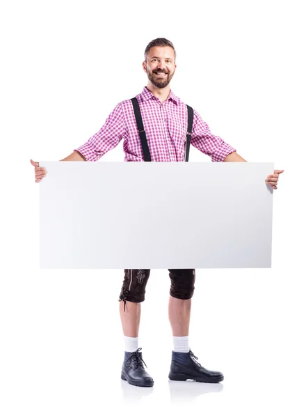 Homme en vêtements bavarois avec tableau blanc — Photo