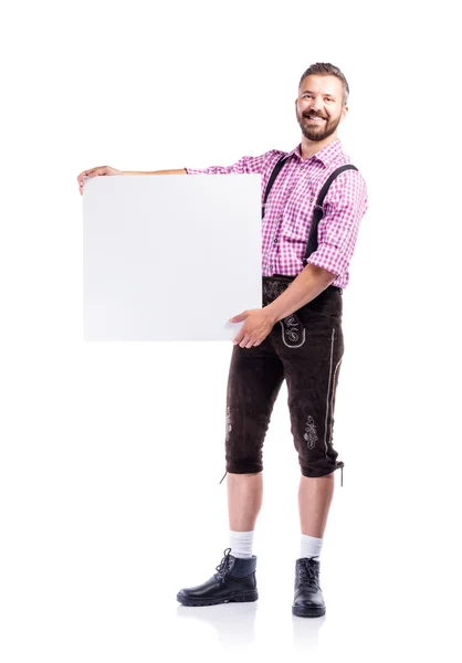 Homme en vêtements bavarois avec tableau blanc — Photo