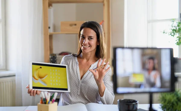 Woman teacher teaching online, coronavirus and online distance learning concept.