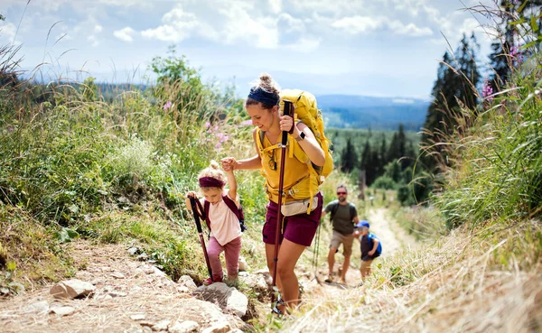 Family with small children hiking outdoors in summer nature, walking in High Tatras. — Stock Photo, Image