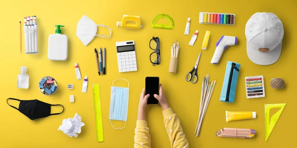 Flat lay top view of child, face mask and school supplies, back to school and coronavirus concept. — Stock Photo, Image