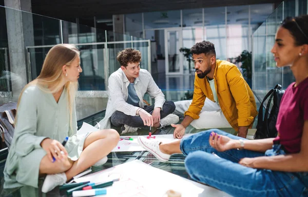 University students activists making banners for protest indoors, fighting for free education concept. — Stock Photo, Image