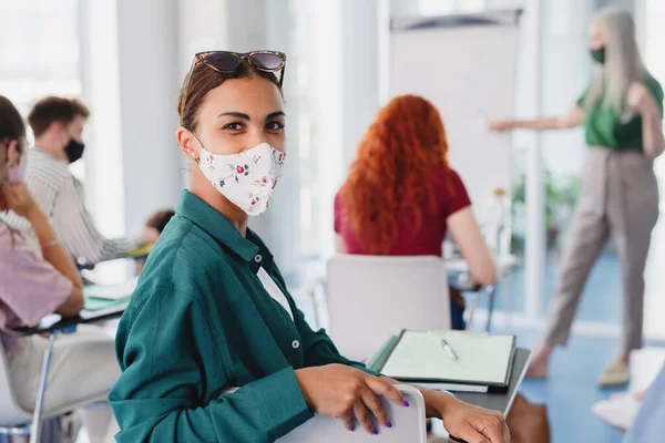 Portrait of university student in classroom indoors, coronavirus and back to normal concept. — Stock Photo, Image