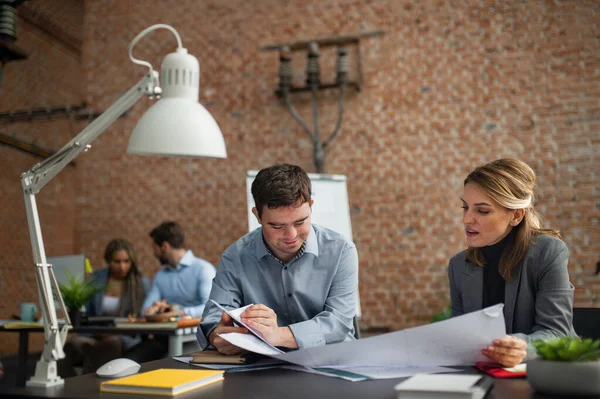 Happy down syndrome man with businesswoman colleague working in office, social inclusion and cooperation concept. — Stock Photo, Image