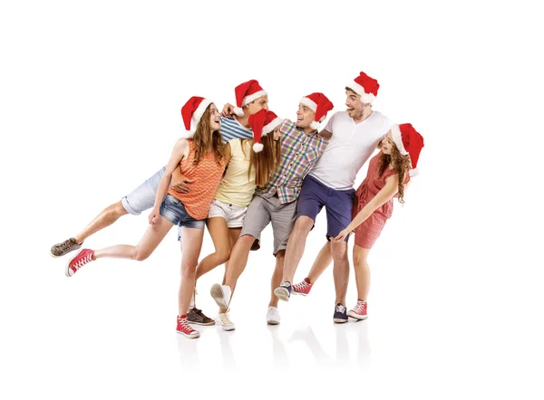 Grupo de estudantes em chapéus de Natal — Fotografia de Stock