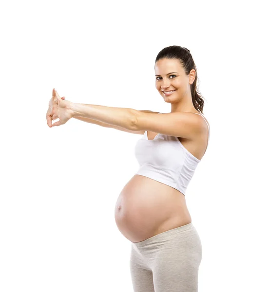 Zwangere vrouw doet oefeningen — Stockfoto