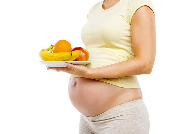 Mujer embarazada con frutas frescas — Foto de Stock