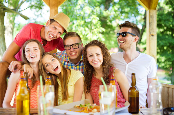 Friends drinking and having fun in pub