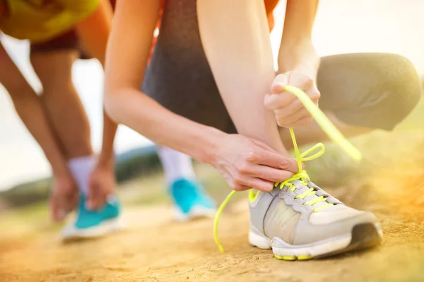 Cross-country trail running people at sunset — Stock Photo, Image