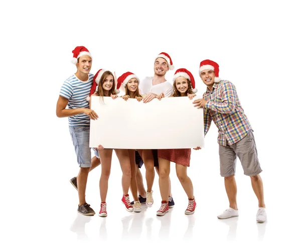 Les gens dans les chapeaux de Père Noël avec espace de copie — Photo