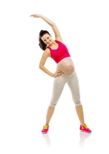 Mujer embarazada haciendo ejercicios — Foto de Stock