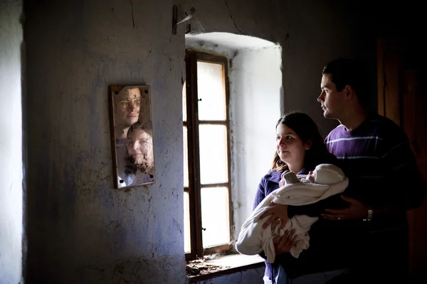 Parents with baby in the house — Stock Photo, Image