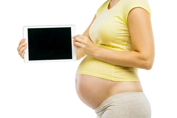 Femme enceinte montrant tablette numérique — Photo