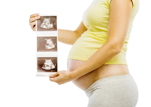 Pregnant woman with ultrasound scan pictures — Stock Photo, Image