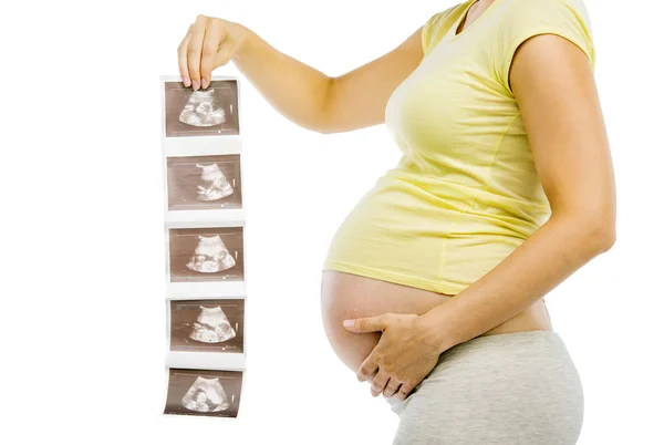 Pregnant woman with ultrasound scan pictures — Stock Photo, Image