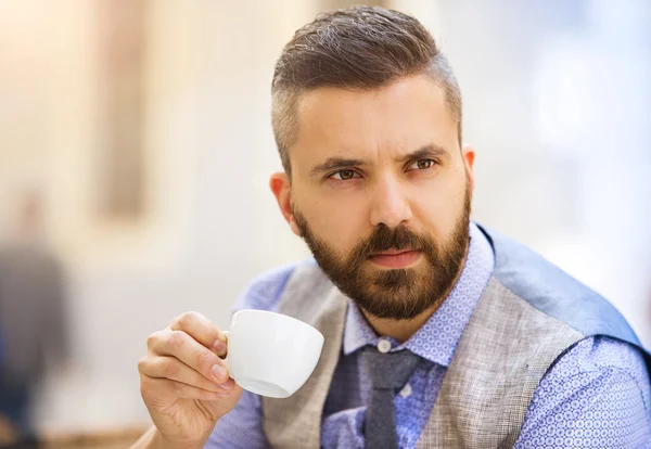 Businessman drinking espresso coffee