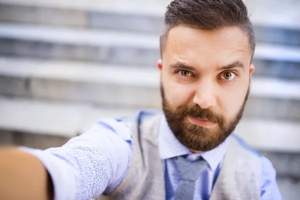 Businessman in glasses and taking selfie — Stock Photo, Image