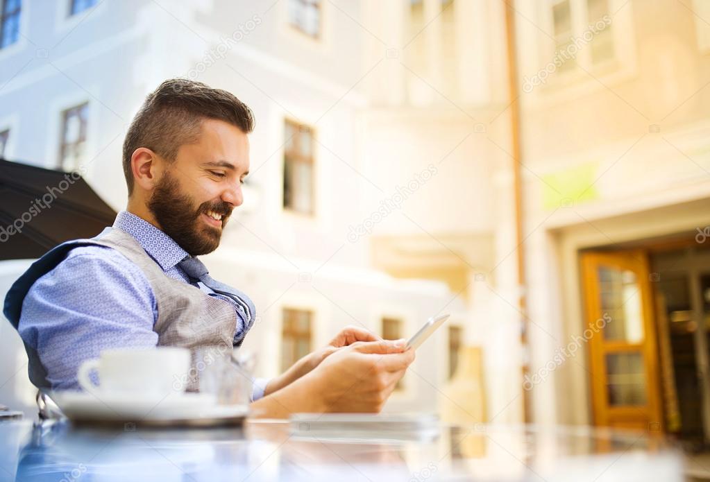 Businessman drinking coffee during lunch time