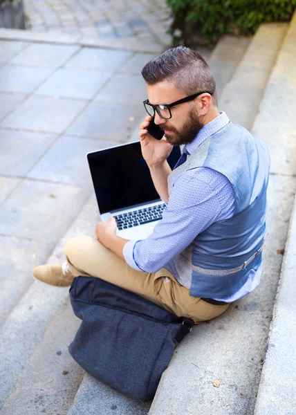 Businessman working on stairs — Stock Photo, Image