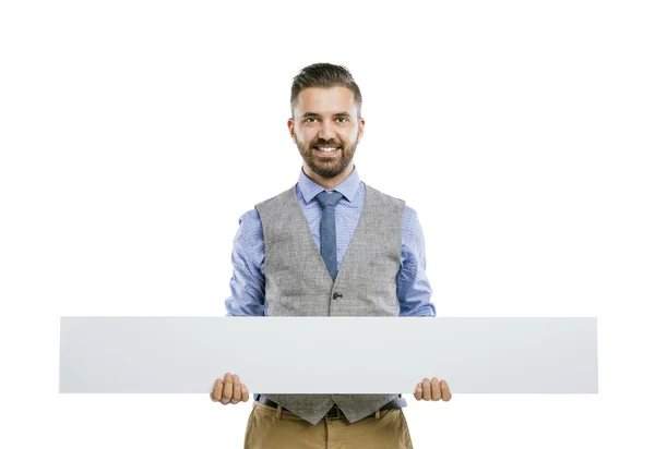 Empresario sosteniendo anuncio en blanco — Foto de Stock