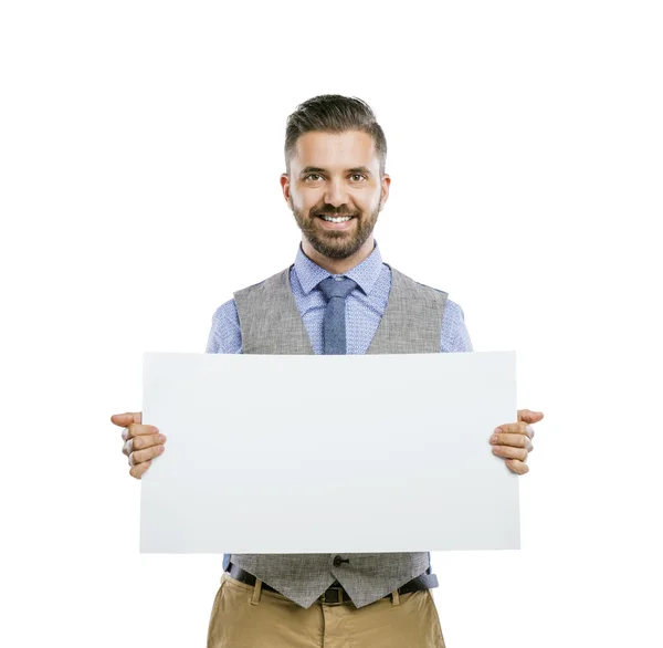 Empresário segurando publicidade em branco — Fotografia de Stock