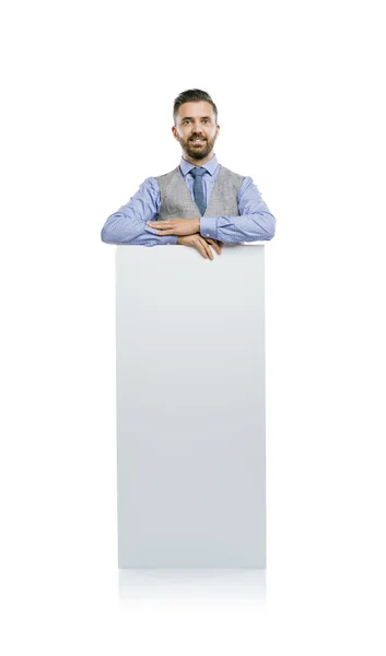 Businessman holding blank advertisement — Stock Photo, Image