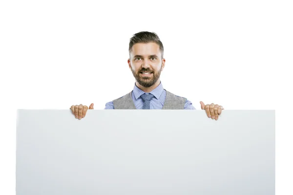 Businessman holding blank advertisement — Stock Photo, Image