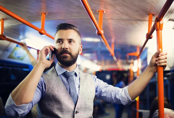 Modern man calling by mobile phone in tram — Stock Photo, Image