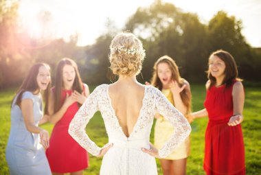 Surprised bridesmaids looking at bride clipart