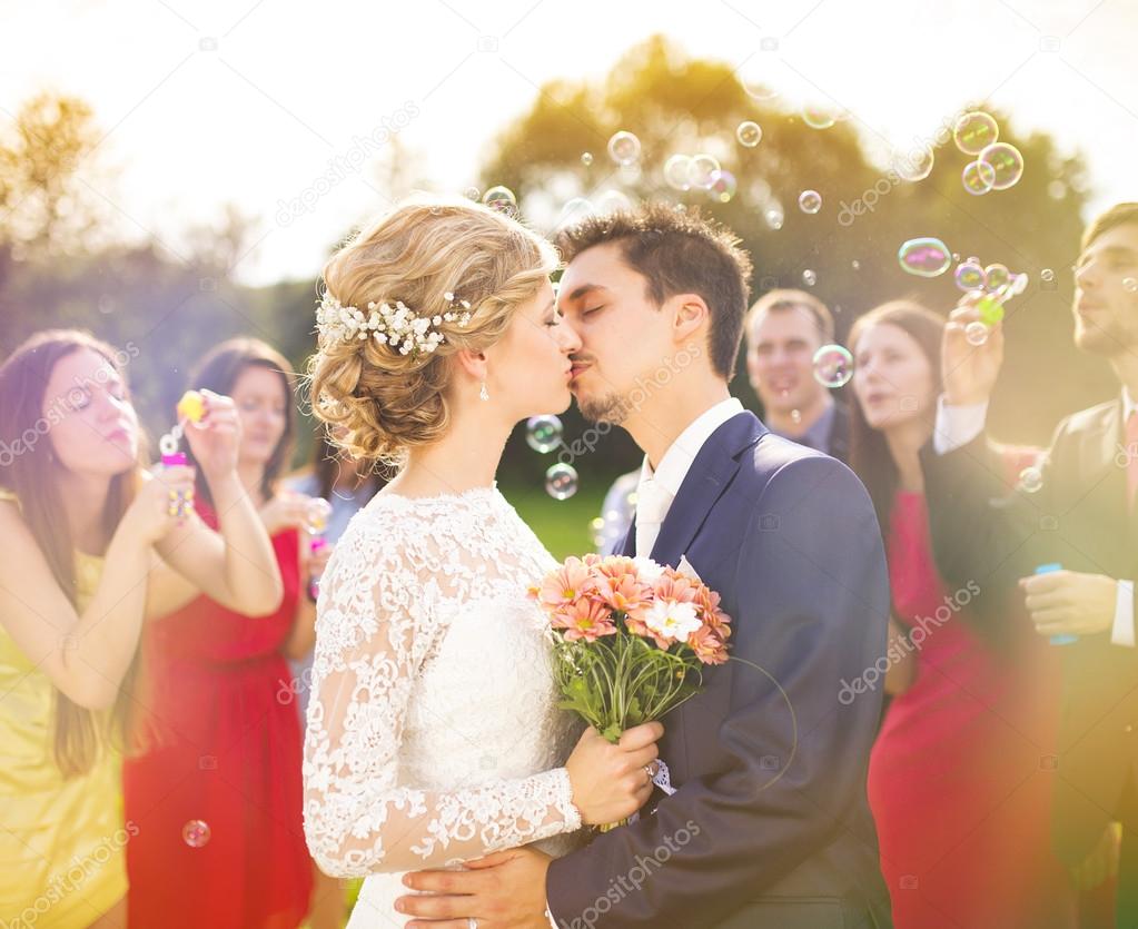 Young newlyweds kissing