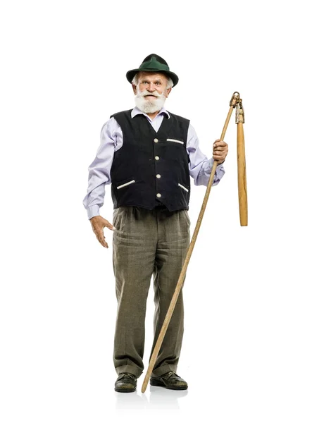 Bavarian man in hat holding flail — Stock Photo, Image