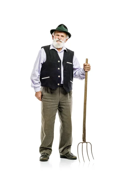 Bavarian man holding pitchfork — Stock Photo, Image