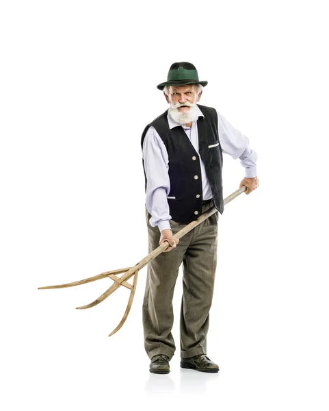 Bavarian man holding pitchfork — Stock Photo, Image