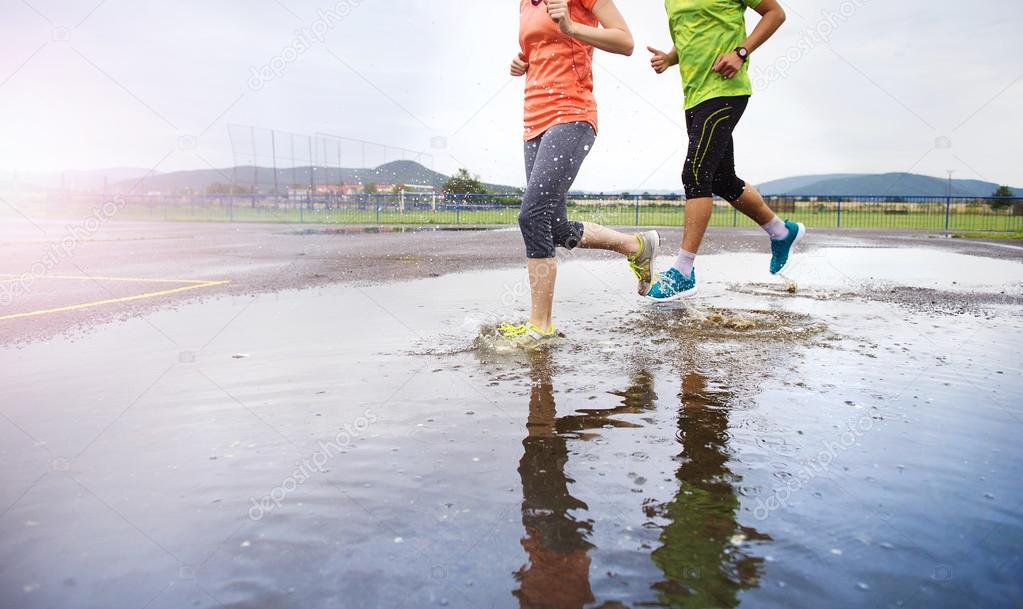 Couple are Jogging in rain.