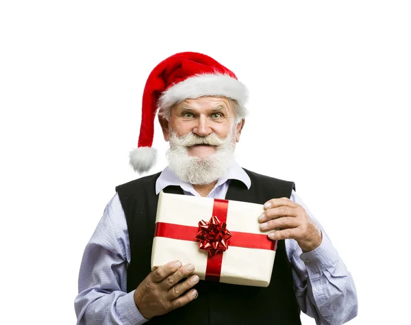 Viejo en sombrero de santa con regalo de Navidad — Foto de Stock