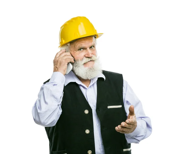 Senior manual worker calling on phone — Stock Photo, Image