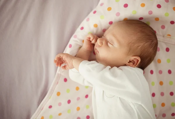 Baby girl sleeping in bed — Stock Photo, Image