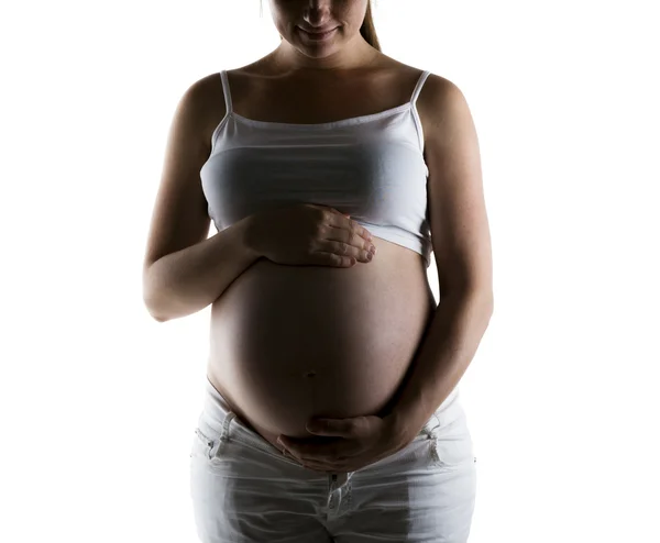 Zwangere vrouw raakt haar buik aan — Stockfoto