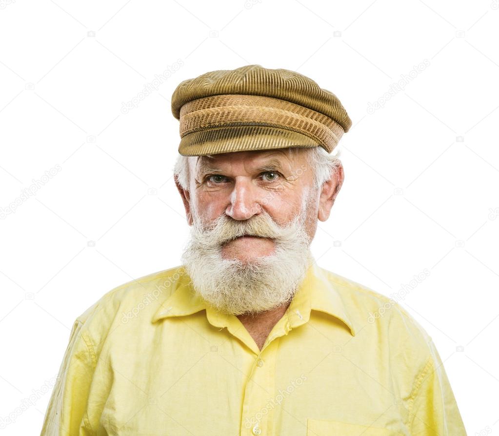 Old bearded man in traditional cap