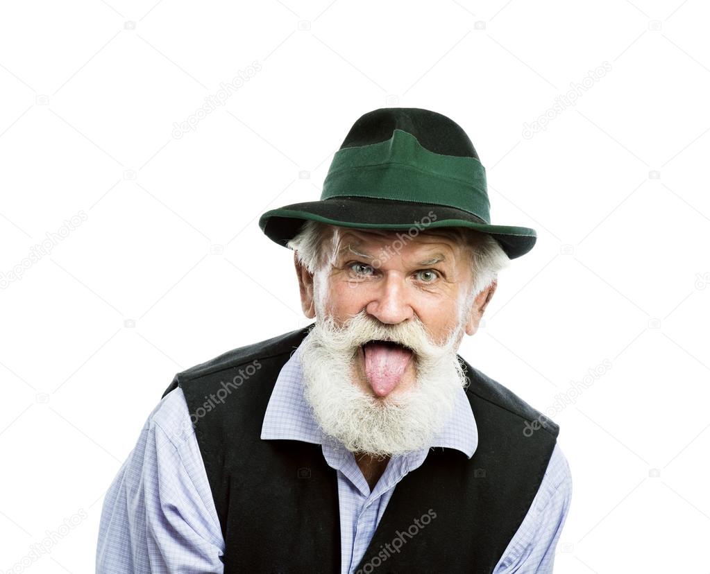 Old bearded man hat sticking his tongue out