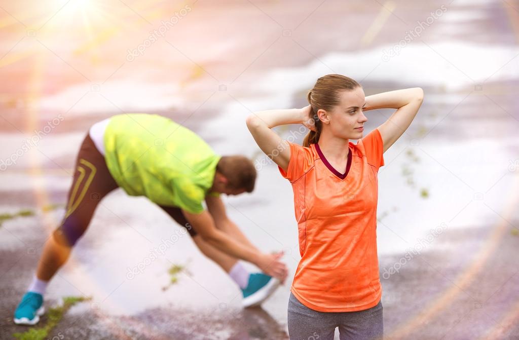 Couple stretching after the run