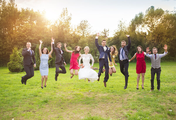 Bridesmaids and groomsmen jumping