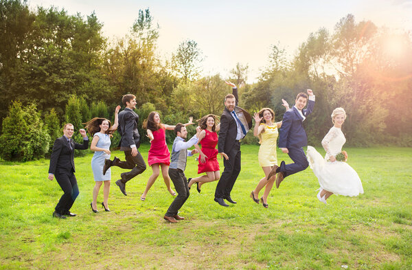 Bridesmaids and groomsmen jumping